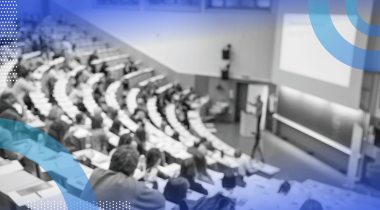 A professor gives a lecture in a lecture hall