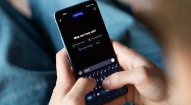 A person types a question into the ChatGPT app.