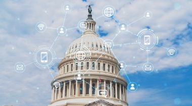 A state capitol building is overlayed with images of smartphones and other technological symbols.