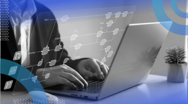 A worker uses a laptop with a database overlay