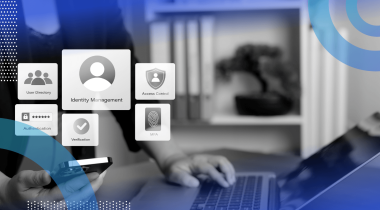 A user works on a laptop with a smartphone and identity access icons