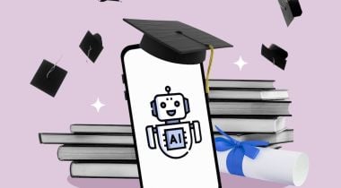 A mobile phone displaying robot has a mortarboard sitting atop it. Books and a diploma are in the background, along with other mortarboards thrown in the air. All this overlays a light-pink background.