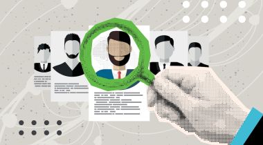A recruiter uses a magnifying glass to examine an applicant's online profile.