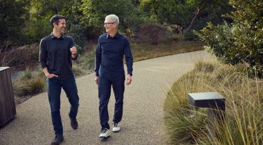 Apple CEO Tim Cook, right, walks with incoming CEO John Ternus at Apple Park.