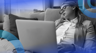 A woman sleeps with a laptop on her lap