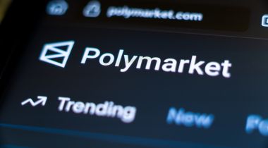 A photo of the Polymarket logo on the computer