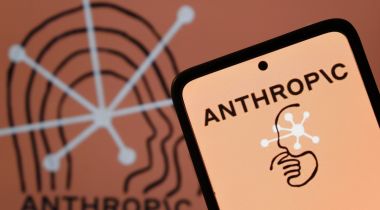 A smartphone showing the Anthropic logo.
