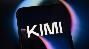 The Kimi logo displayed on a black phone screen, with a black background illuminated by a purple light.