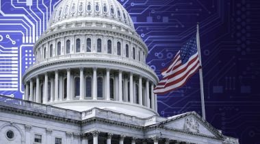 A picture of the Capitol building with an American flag, with a computer chip board in the background.