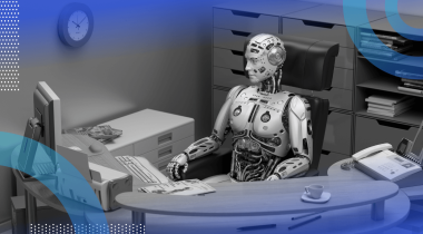A robot sits at a desk