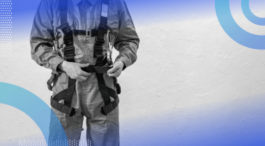 A worker wearing a safety harness