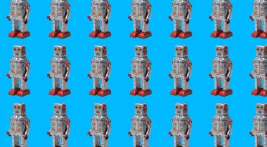 Rows of humanoid robots, with a light-blue background.