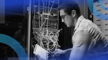 A network engineer works with a tablet