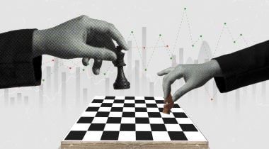 Two hands move pieces on a chess board.
