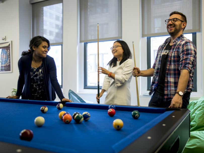 The Trade Desk engineering team playing pool