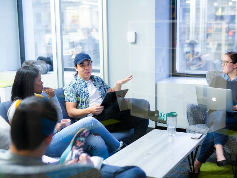 Buildout employees sitting on a couch working