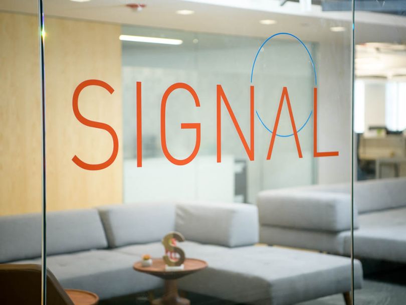 SIgnal logo displayed on a glass window