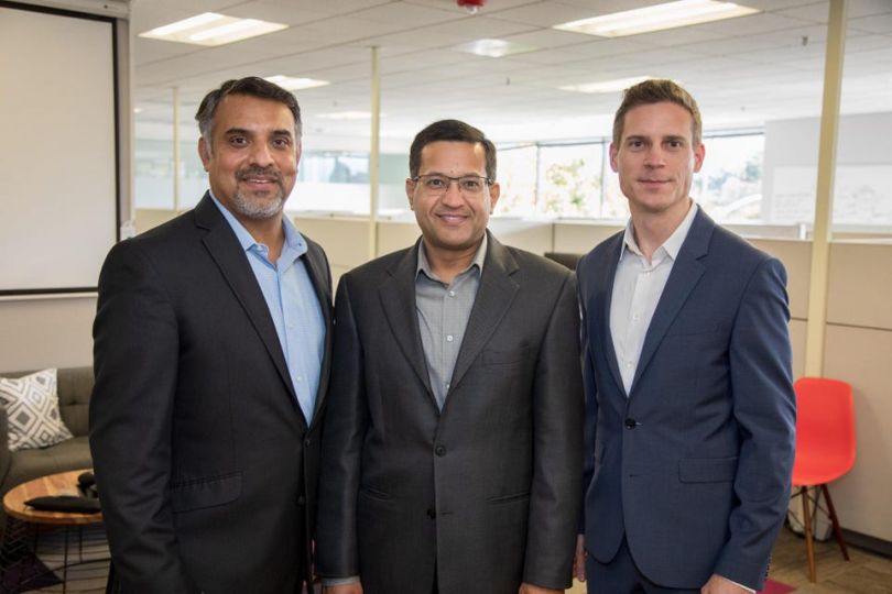 Astera Lab’s co-founders pose together for a photo in an office