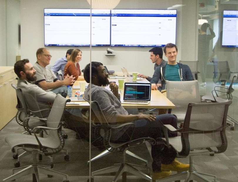 Avant employees working in conference room