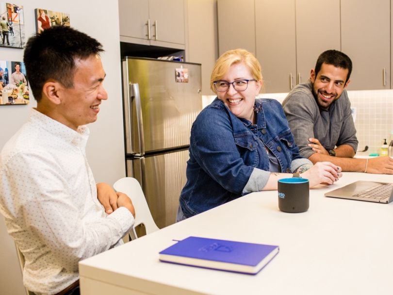 Bento for Business team chatting in their office
