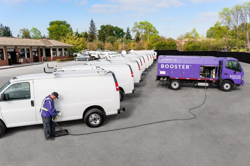 a booster van providing fuel to a fleet vehicle