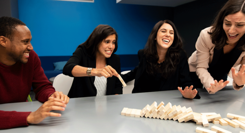 Box team members playing Jenga