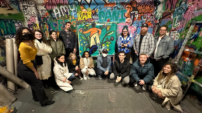 Lead Product Designer, Customer Experience, Ramya Baratam and Senior Product Designer Daniela Marmolejos stand among Spring Health team members.
