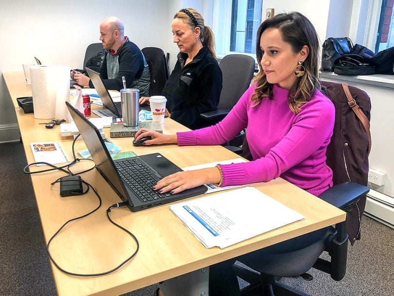 CMMS Data Group employees working