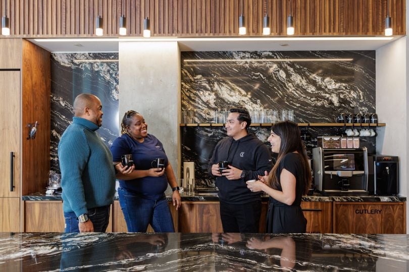 Checkout.com employees chat in the company's New York office