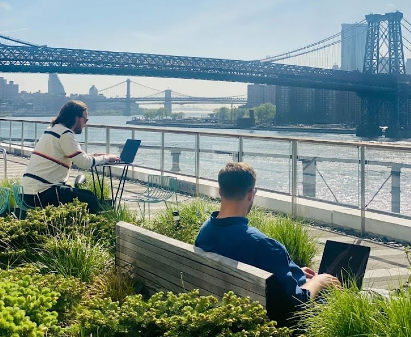 Chronograph team members working outside along the river