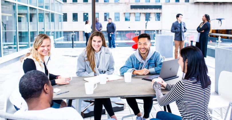 Cisco Meraki team chatting on outdoor patio