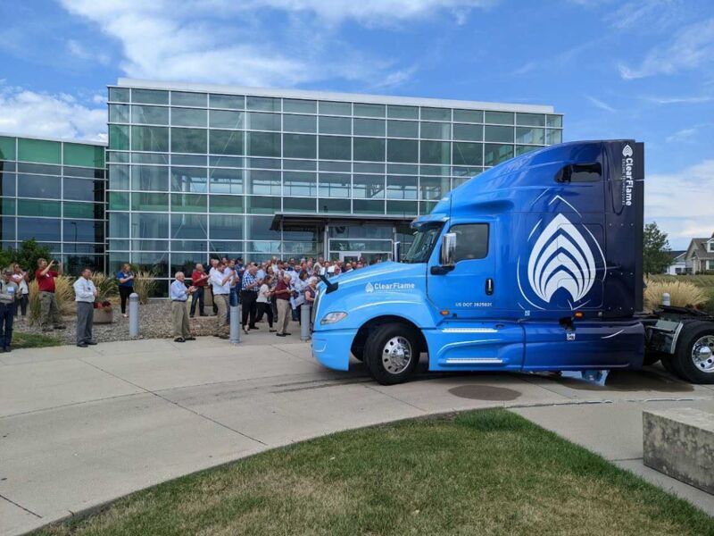 A ClearFlame Engine Technologies truck in front of a building. 