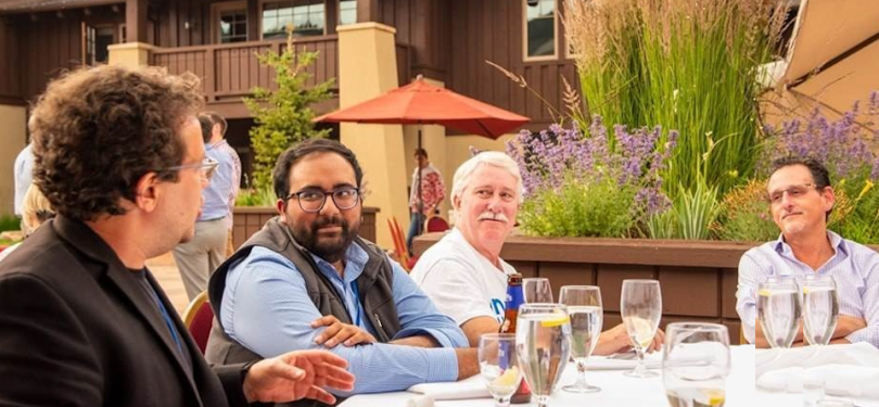 Cloud5 Communications team members chatting at dinner