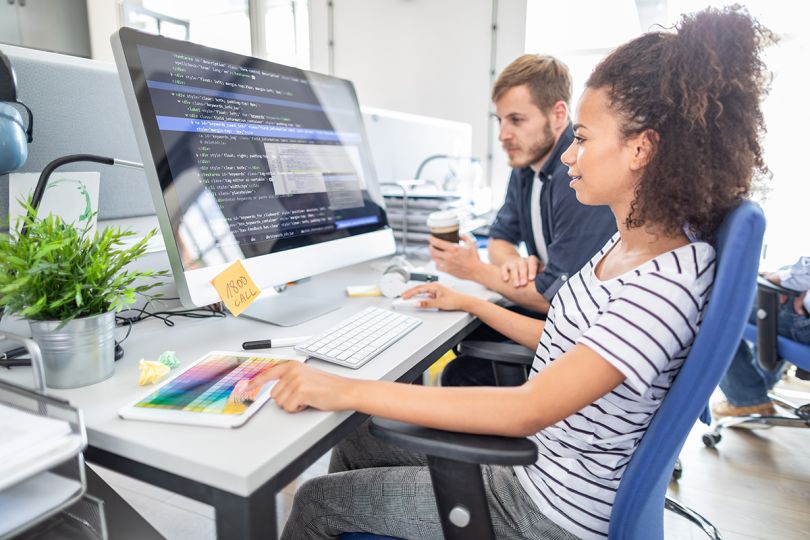Programmer working in a software develop company office.