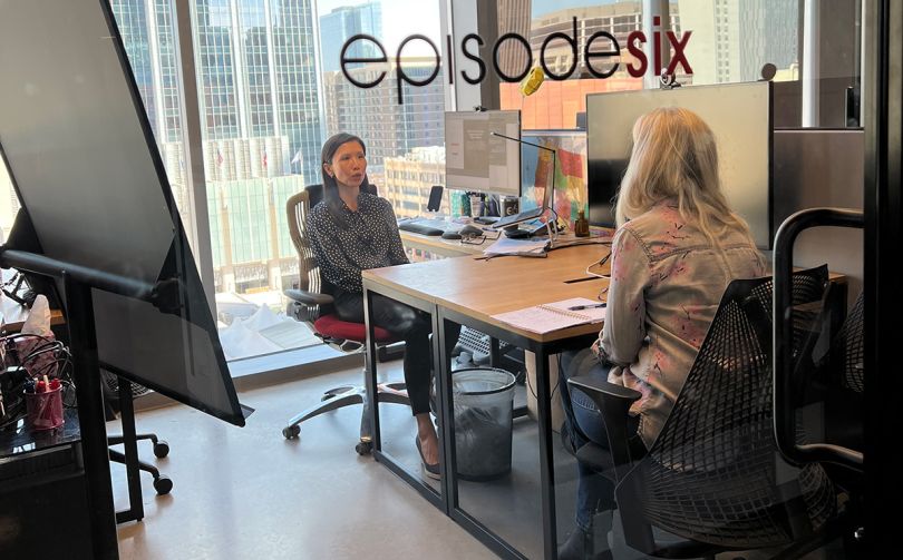 Episode Six manager having a meeting with a team member