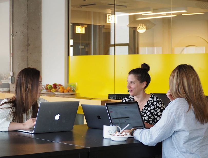 Evive team members working at a table