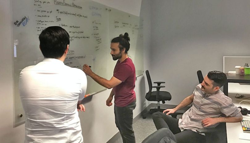 Fooda tech team members working in a conference room
