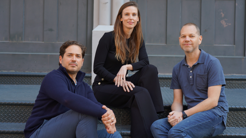 Fora co-founders sitting on steps
