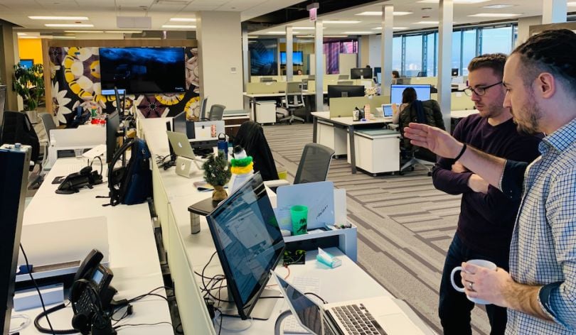FourKites staff shown working in wide office shot