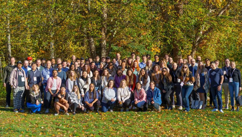 GlossGenius team members pose for a group photo at an outdoor company activity.