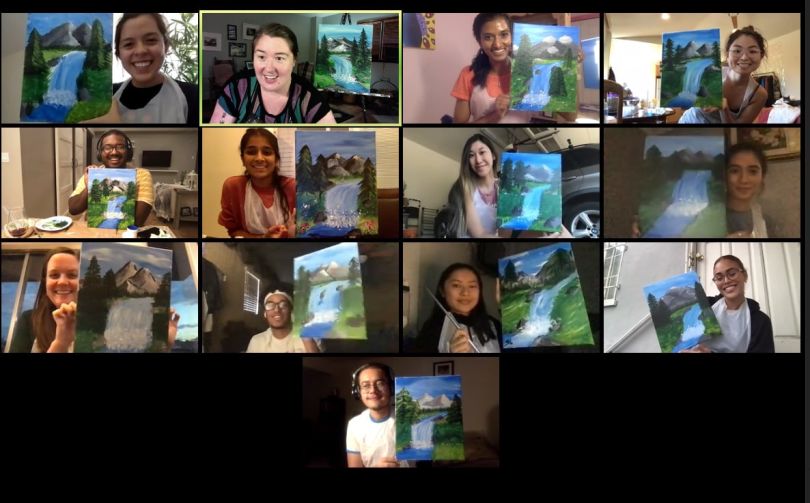 Handshake team members having a virtual paint night via a video call