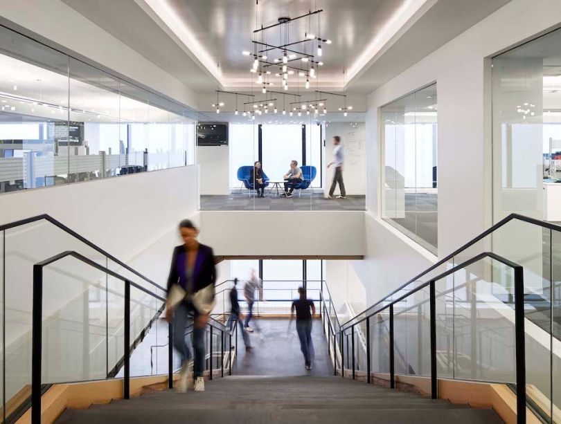 Photo looking down from top of staircase at IMC Trading office