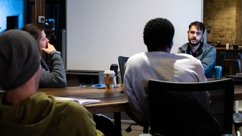 Lightstream staff having discussion in conference room