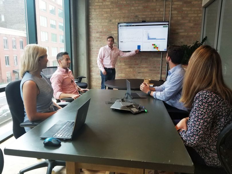 LogicGate team working in a conference room