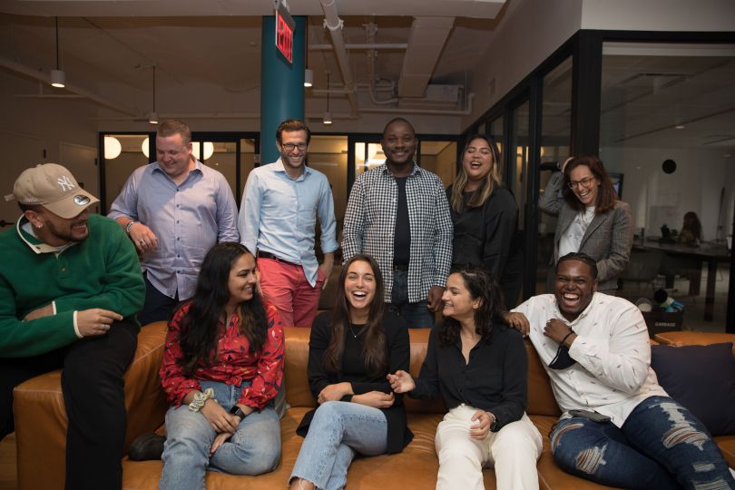 A group of Melio employees at the office.