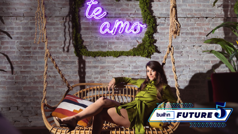 Co-founder and CEO of La Vette Social Club Mia Lux lounges on a swing under a neon sign