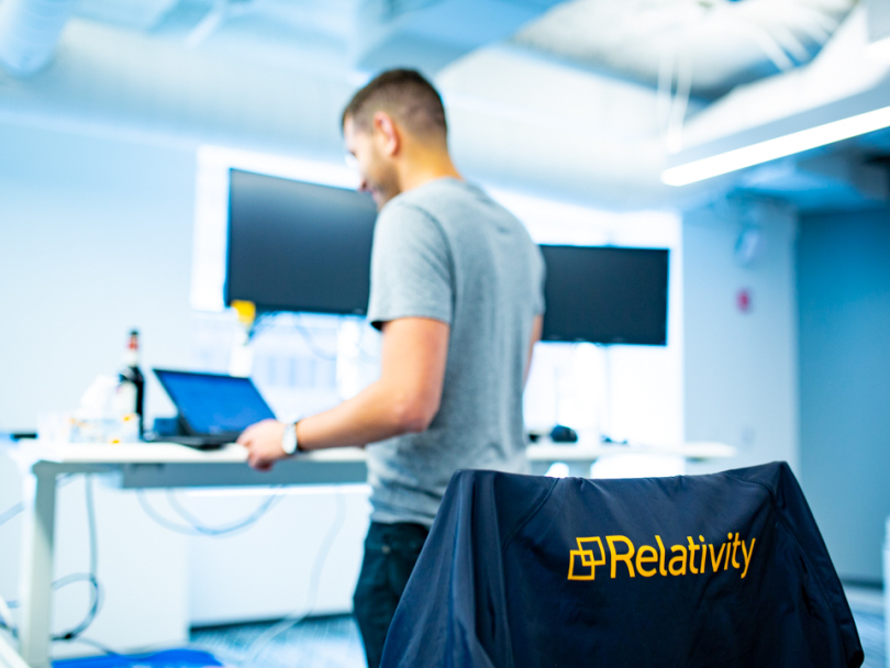 Staff member working in Relativity's office