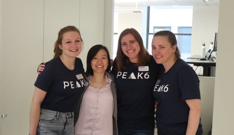 Women from PEAK6 team in group photo 
