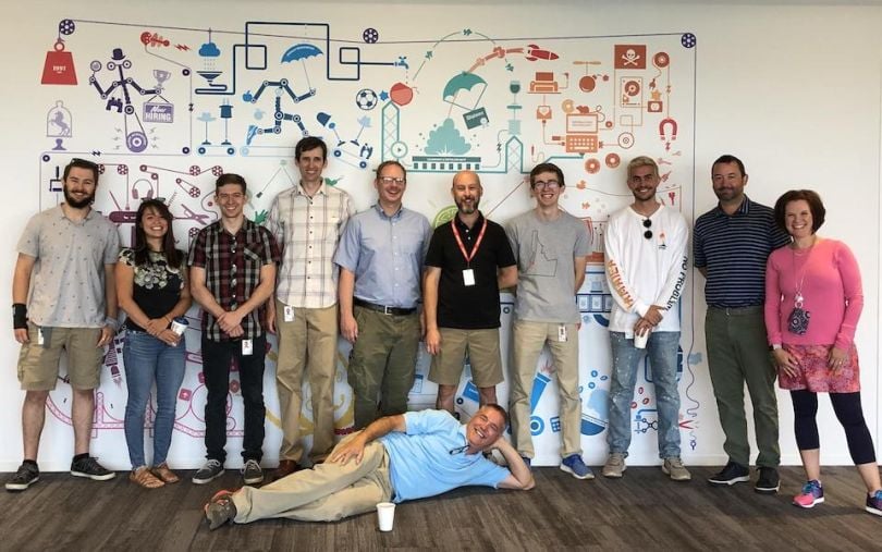 Paylocity team posing in their office