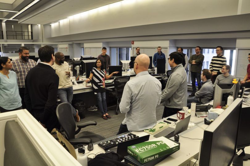PEAK6 team having meeting in office